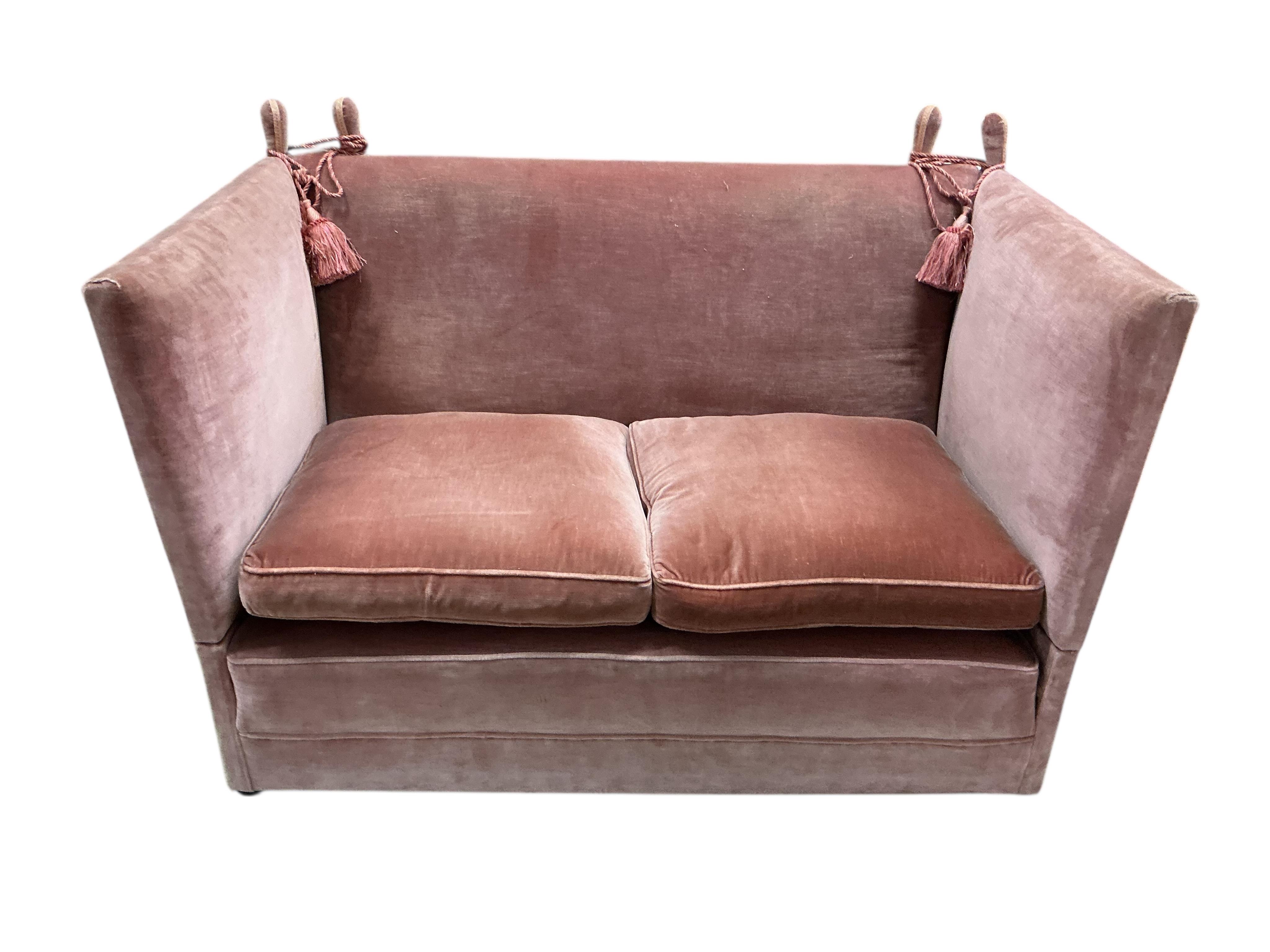An upholstered two seater Knole settee, width 148cm, depth 84cm, height 101cm